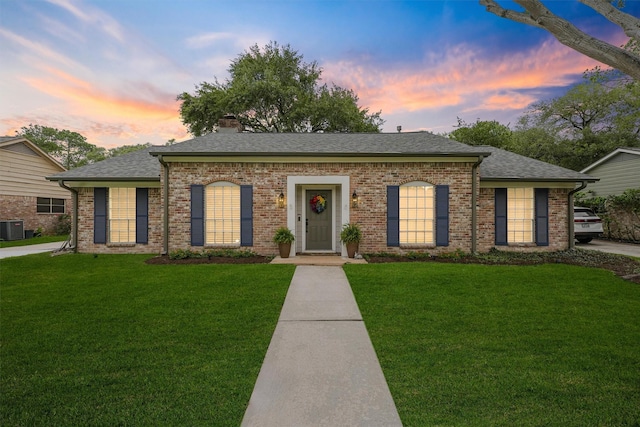 12510 Deep Spring Ln, Houston, TX 77077 - view of front of home featuring a front lawn, a chimney, and brick siding