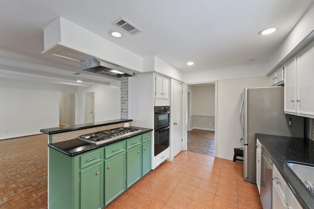 12510 Deep Spring Ln, Houston, TX 77077 - kitchen featuring appliances with stainless steel finishes, green cabinets, white cabinets, decorative backsplash, and recessed lighting
