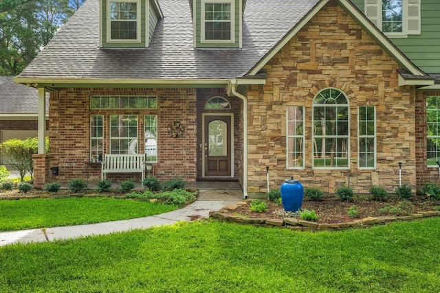 27210 Hitching Post Ct, Magnolia, TX 77355 - view of front of house with stone siding, a front lawn, and roof with shingles