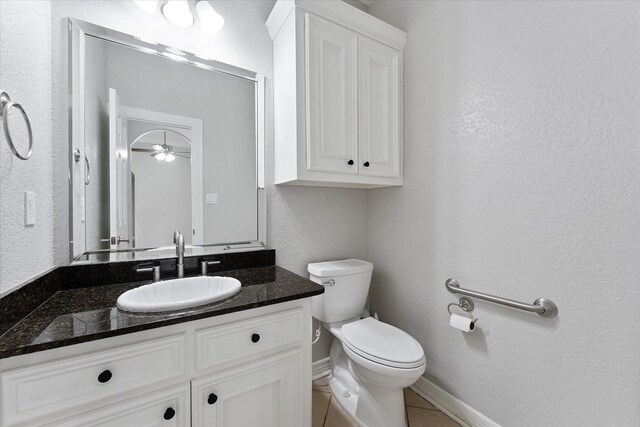 27210 Hitching Post Ct, Magnolia, TX 77355 - half bathroom with vanity, a textured wall, a ceiling fan, and tile patterned floors