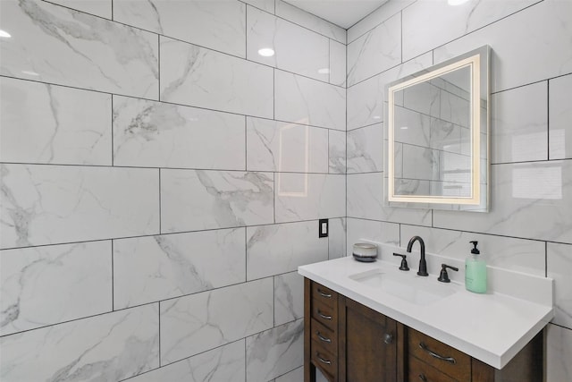 7826 Braesview Ln, Houston, TX 77071 - bathroom featuring vanity and tile walls