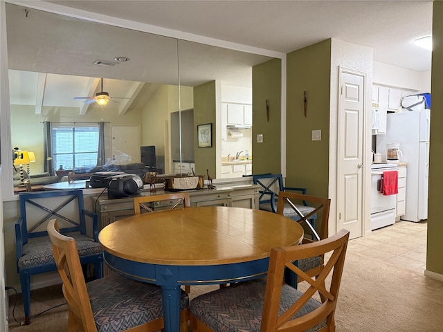 5711 Sugar Hill Dr Unit 46, Houston, TX 77057 - dining room featuring light carpet, a ceiling fan, and light tile patterned floors
