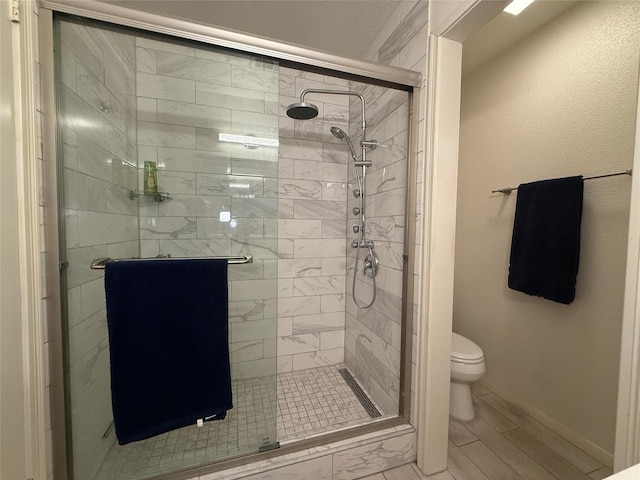5711 Sugar Hill Dr Unit 46, Houston, TX 77057 - full bathroom with a stall shower and toilet