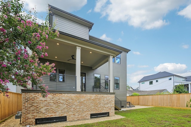 1023 Grovewood Ln, Houston, TX 77008 - rear view of property with brick siding and a ceiling fan