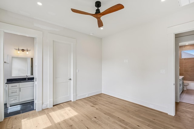 1023 Grovewood Ln, Houston, TX 77008 - unfurnished bedroom with light wood finished floors, recessed lighting, ensuite bath, and a ceiling fan