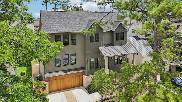 1023 Grovewood Ln, Houston, TX 77008 - view of front of house with a standing seam roof, a shingled roof, and a metal roof