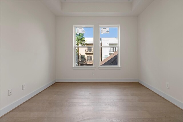5117 Schuler St Unit B, Houston, TX 77007 - spare room with light wood finished floors and a tray ceiling