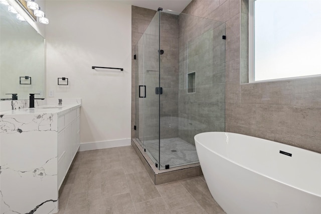 5117 Schuler St Unit B, Houston, TX 77007 - bathroom with a freestanding tub, vanity, a stall shower, and tile patterned flooring