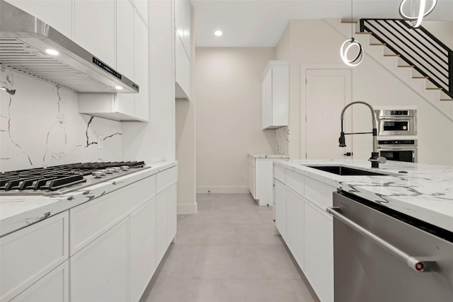5117 Schuler St Unit B, Houston, TX 77007 - kitchen with stainless steel appliances, extractor fan, light stone countertops, white cabinets, and recessed lighting
