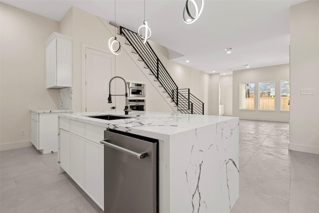 5117 Schuler St Unit B, Houston, TX 77007 - kitchen featuring dishwasher, an island with sink, white cabinetry, light stone counters, and open floor plan