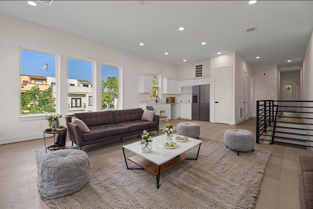 5117 Schuler St Unit B, Houston, TX 77007 - living area featuring recessed lighting, stairway, and light wood-style floors