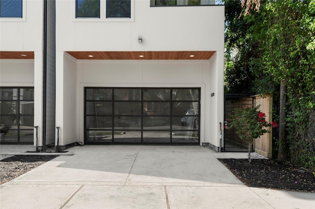 5117 Schuler St Unit B, Houston, TX 77007 - garage featuring concrete driveway and a gate