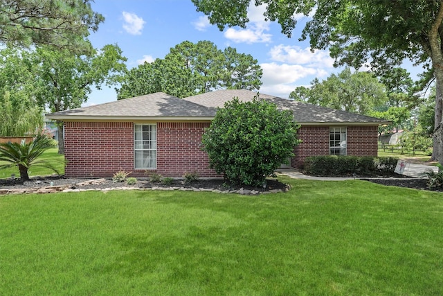 17010 Cypress Knee Dr, Cypress, TX 77429 - single story home featuring a front lawn, roof with shingles, and brick siding