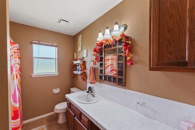 17010 Cypress Knee Dr, Cypress, TX 77429 - bathroom with vanity, tile patterned flooring, and a textured wall