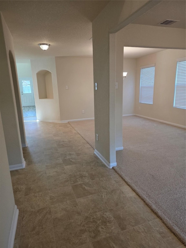 15319 Roaming River Trl, Houston, TX 77044 - hall with arched walkways and plenty of natural light