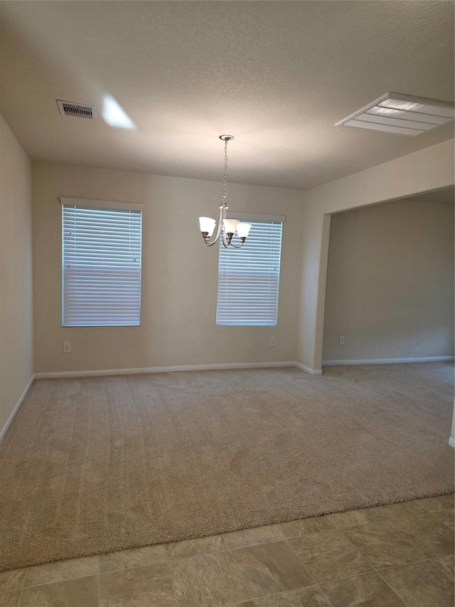 15319 Roaming River Trl, Houston, TX 77044 - unfurnished room with carpet flooring and a chandelier