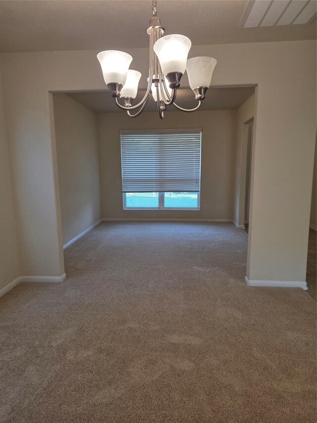 15319 Roaming River Trl, Houston, TX 77044 - spare room featuring a chandelier and carpet floors