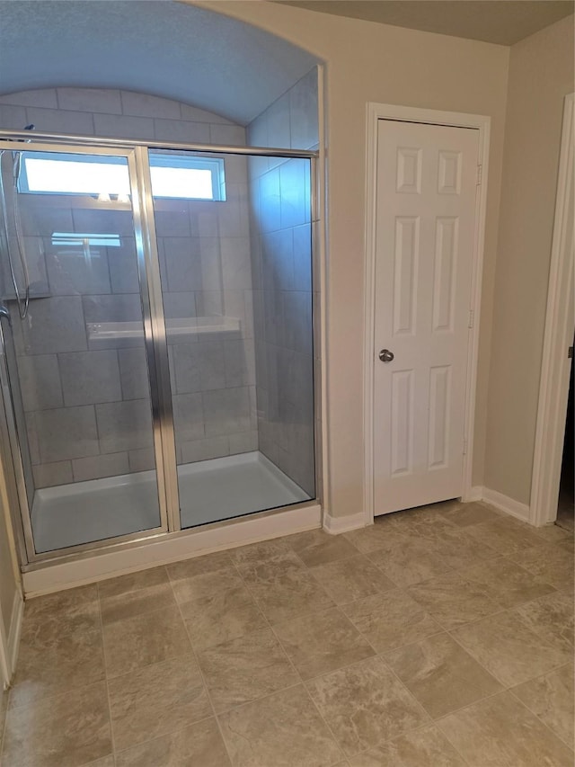15319 Roaming River Trl, Houston, TX 77044 - full bath featuring a shower stall and baseboards