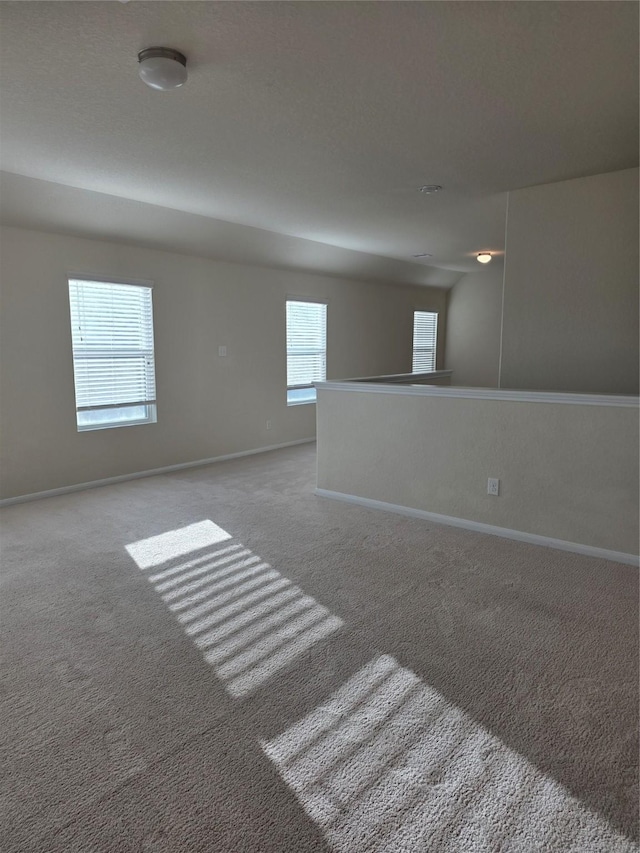 15319 Roaming River Trl, Houston, TX 77044 - spare room featuring carpet and baseboards