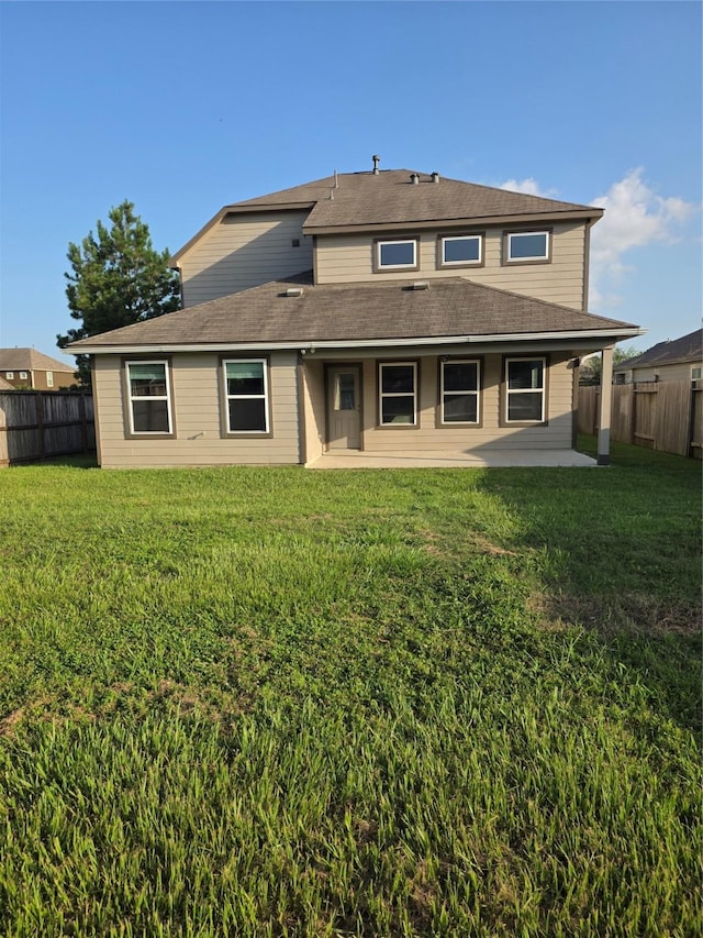 15319 Roaming River Trl, Houston, TX 77044 - rear view of house with a patio, a fenced backyard, and a shingled roof