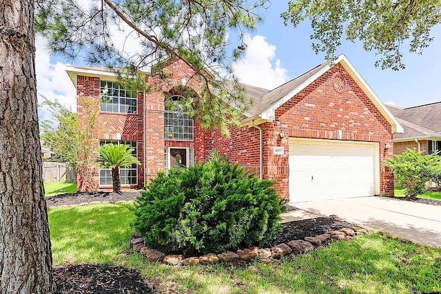 1622 Maryvale Dr, Katy, TX 77494 - traditional-style home featuring brick siding, an attached garage, concrete driveway, and a front yard