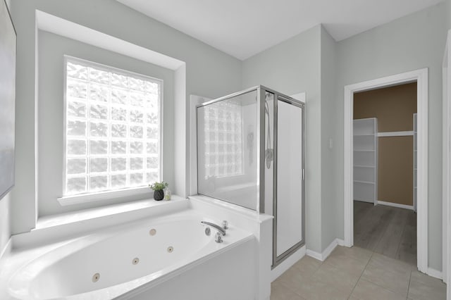 1622 Maryvale Dr, Katy, TX 77494 - bathroom featuring a shower stall, a whirlpool tub, and plenty of natural light