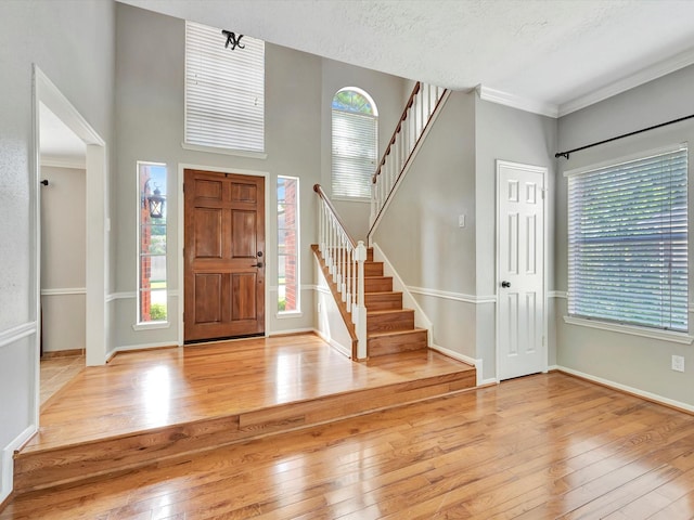 1227 Redwood Bough Ln, Houston, TX 77062 - entryway featuring hardwood / wood-style floors, stairs, healthy amount of natural light, and ornamental molding