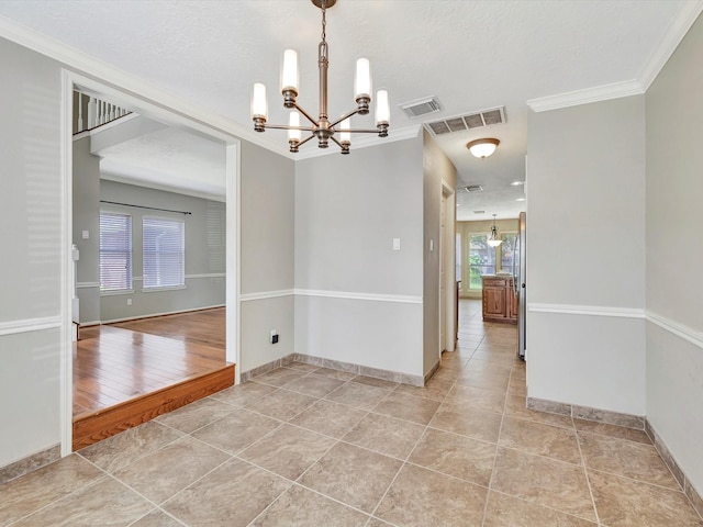1227 Redwood Bough Ln, Houston, TX 77062 - spare room featuring a chandelier, light tile patterned floors, and ornamental molding