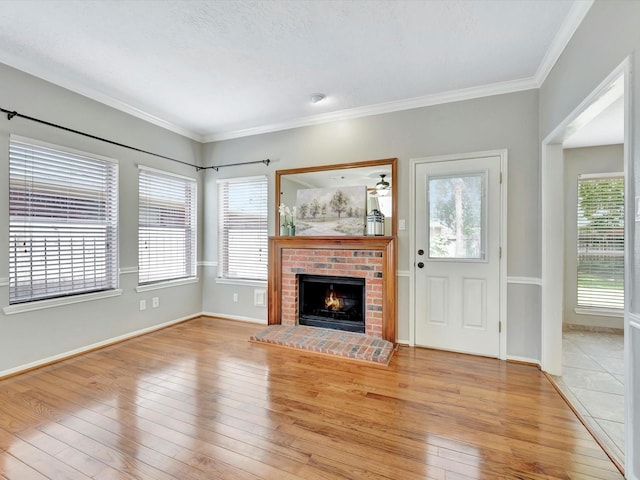 1227 Redwood Bough Ln, Houston, TX 77062 - unfurnished living room featuring light wood-type flooring, a fireplace, and crown molding