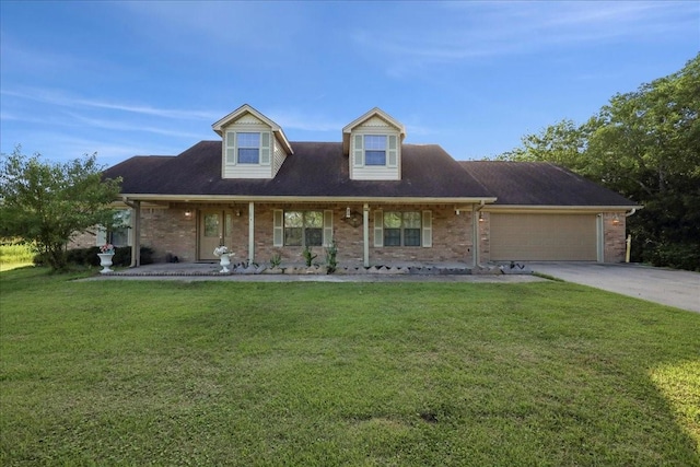 11156 Country Ln, Beaumont, TX 77705 - cape cod-style house featuring an attached garage, covered porch, driveway, and brick siding