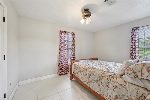 11156 Country Ln, Beaumont, TX 77705 - bedroom with baseboards and light tile patterned flooring