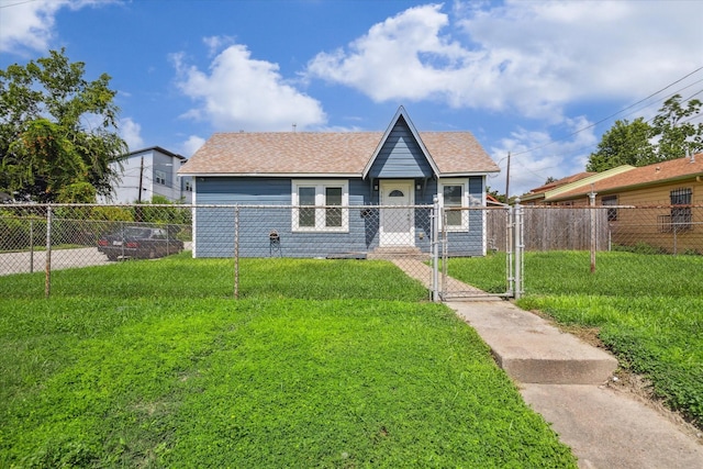 1115 Alber St, Houston, TX 77009 - view of front of home with a gate, a fenced front yard, and a shingled roof