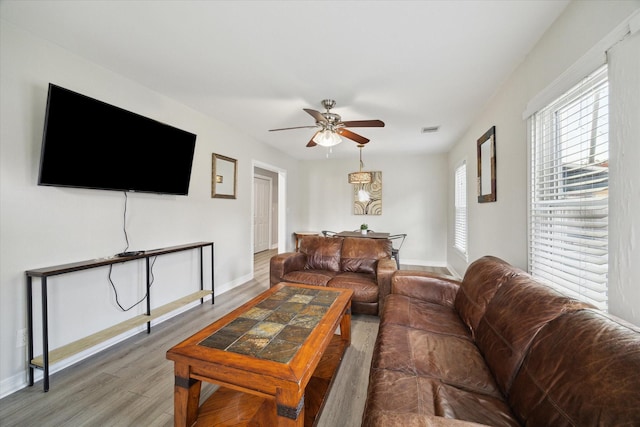 1115 Alber St, Houston, TX 77009 - living area featuring a ceiling fan and wood finished floors