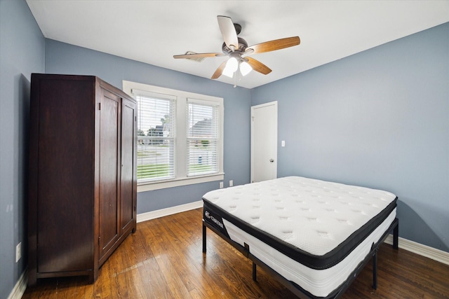 1115 Alber St, Houston, TX 77009 - bedroom featuring dark wood-style flooring and a ceiling fan
