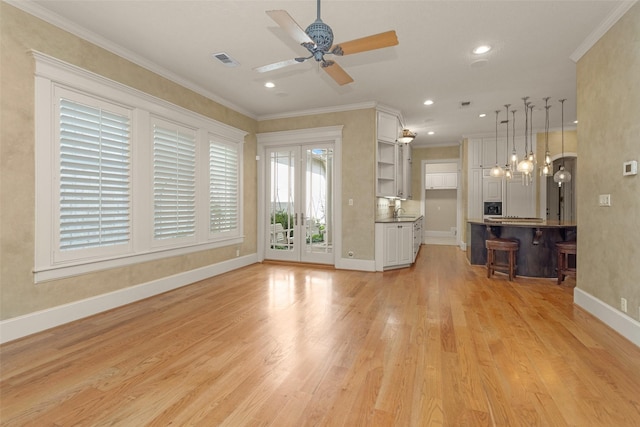 6616 Queensclub Dr, Houston, TX 77069 - unfurnished living room featuring a ceiling fan, crown molding, light wood finished floors, and recessed lighting