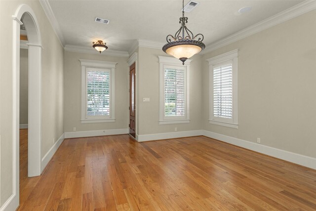 6616 Queensclub Dr, Houston, TX 77069 - spare room with light wood finished floors, ornamental molding, and arched walkways