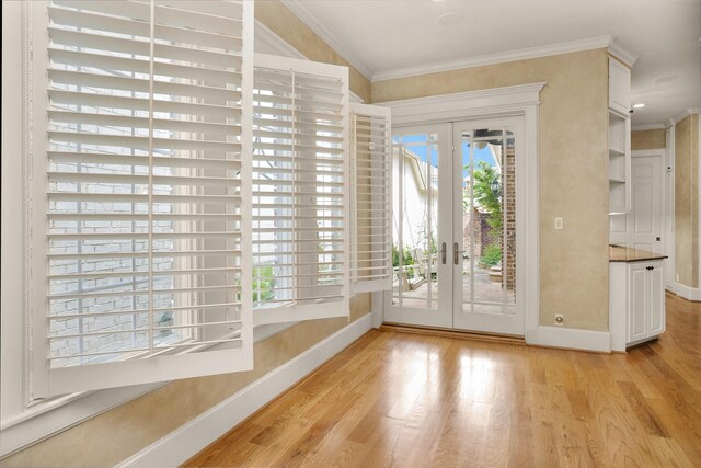 6616 Queensclub Dr, Houston, TX 77069 - doorway to outside with french doors, plenty of natural light, light wood finished floors, and crown molding