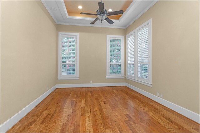 6616 Queensclub Dr, Houston, TX 77069 - unfurnished room featuring crown molding, plenty of natural light, ceiling fan, a raised ceiling, and light wood finished floors