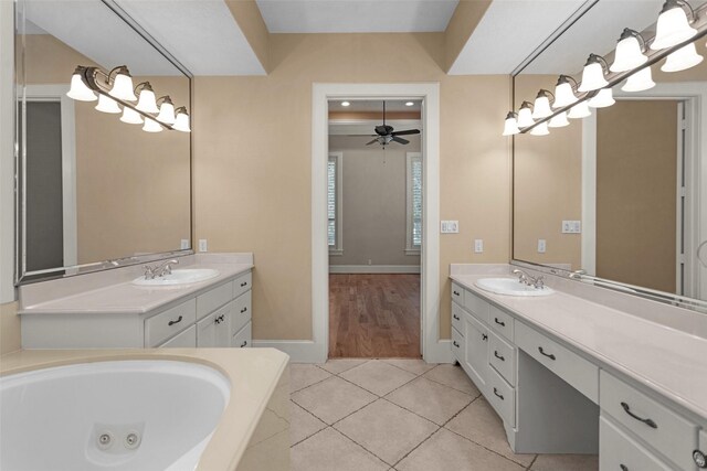 6616 Queensclub Dr, Houston, TX 77069 - full bath with vanity, ceiling fan, tile patterned floors, and a jetted tub