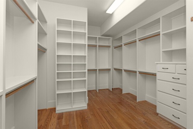 6616 Queensclub Dr, Houston, TX 77069 - walk in closet featuring wood finished floors