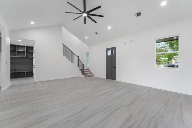 256 Davis Bend Rd, Alvin, TX 77511 - unfurnished living room with ceiling fan, stairway, recessed lighting, and high vaulted ceiling