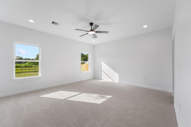 256 Davis Bend Rd, Alvin, TX 77511 - unfurnished room with light carpet, a ceiling fan, and recessed lighting