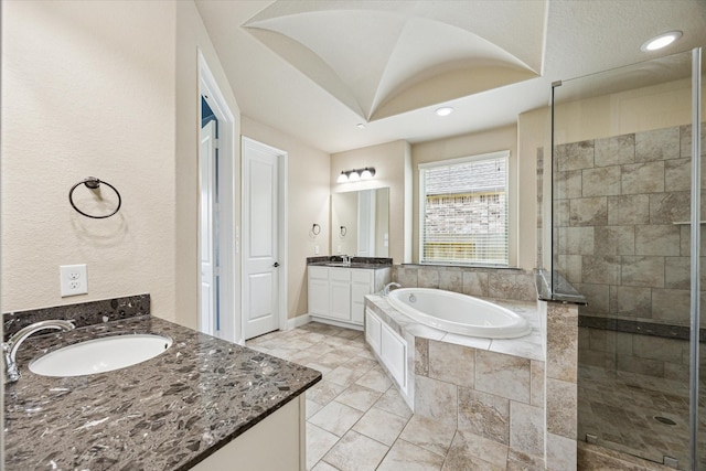4906 Lodge Lake Dr, Fulshear, TX 77441 - bathroom with two vanities, a bath, a stall shower, and recessed lighting