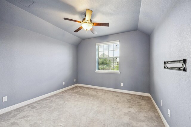 4906 Lodge Lake Dr, Fulshear, TX 77441 - carpeted empty room with lofted ceiling and a ceiling fan