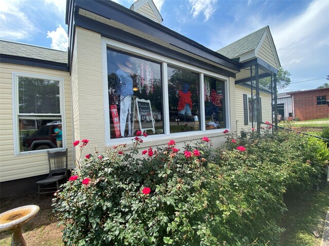 312 Spring, Washington, GA 30673 - view of home's exterior with roof with shingles