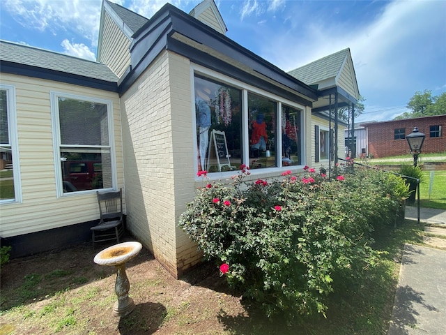 312 Spring, Washington, GA 30673 - view of side of home with a shingled roof and brick siding
