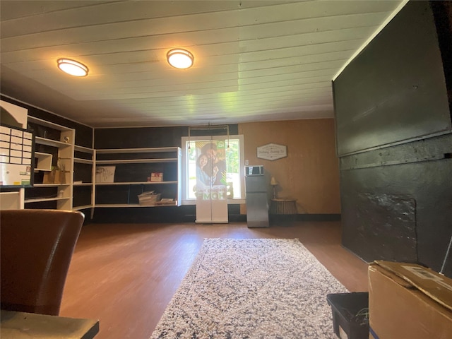 312 Spring, Washington, GA 30673 - unfurnished living room featuring wood finished floors and wood ceiling