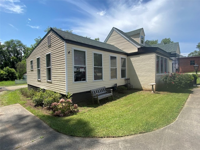 312 Spring, Washington, GA 30673 - view of home's exterior with a yard and a shingled roof