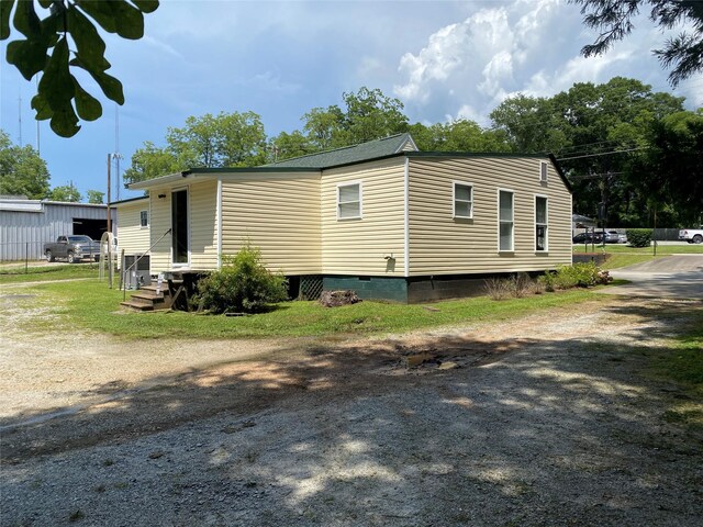 312 Spring, Washington, GA 30673 - view of property exterior with entry steps and crawl space