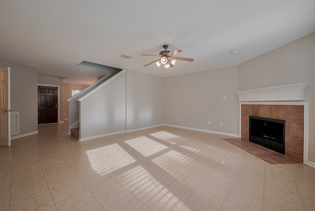 9714 Angleside Ln, Sugar Land, TX 77498 - unfurnished living room with a ceiling fan, light tile patterned floors, stairway, and a fireplace